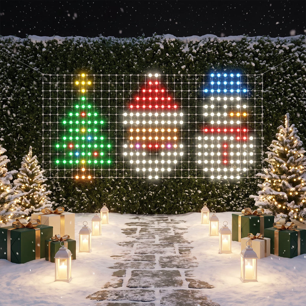 The XL net on a snowy hedge showing a Christmas tree, Santa and a snowman side by side